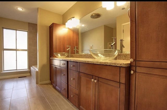 bathroom featuring vanity and tile patterned flooring