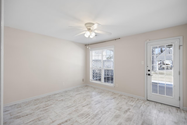 empty room featuring light hardwood / wood-style flooring and ceiling fan