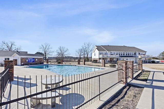 view of swimming pool with a patio