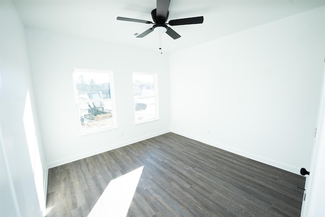 unfurnished room featuring ceiling fan and dark hardwood / wood-style flooring