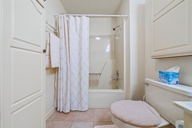 bathroom featuring shower / tub combo with curtain, toilet, tile patterned flooring, and a textured ceiling