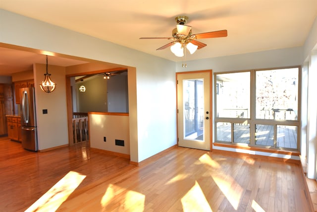 spare room with light hardwood / wood-style floors and ceiling fan