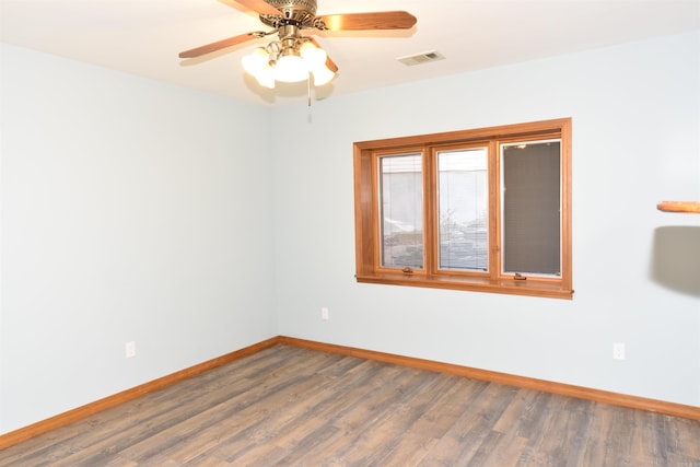 unfurnished room with ceiling fan and wood-type flooring