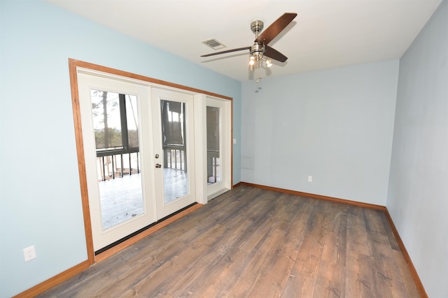 unfurnished room with dark hardwood / wood-style floors, french doors, and ceiling fan