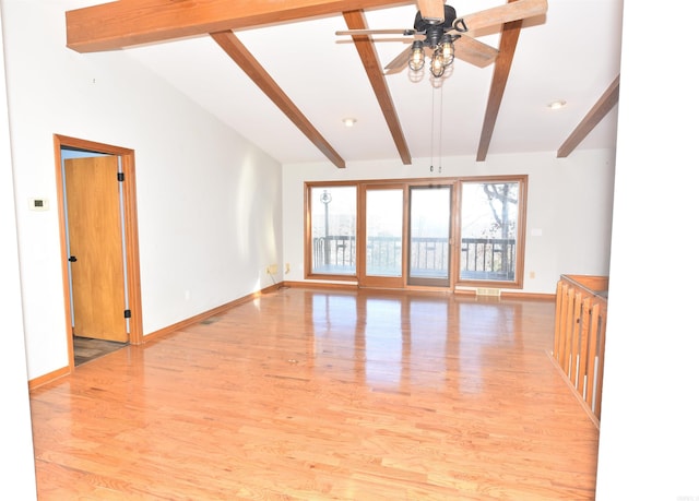 unfurnished room featuring lofted ceiling with beams, ceiling fan, and light wood-type flooring