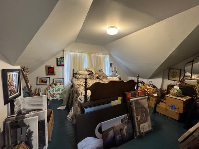 bedroom featuring lofted ceiling