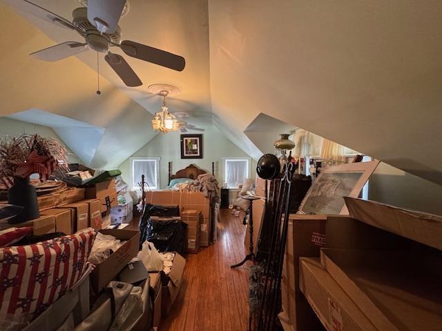 bedroom featuring lofted ceiling and wood-type flooring