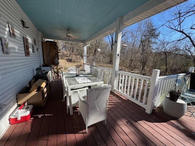 wooden deck featuring ceiling fan