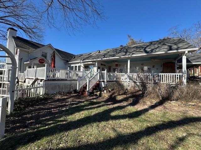 back of house with a porch