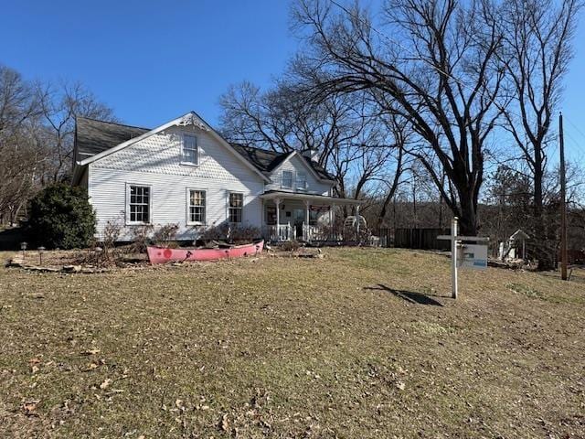 exterior space with a front yard and covered porch