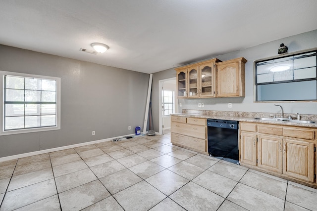 kitchen featuring light tile patterned flooring, dishwasher, sink, and light brown cabinets