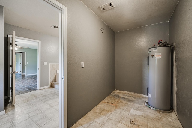 utility room with water heater