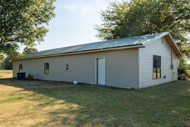 exterior space featuring a yard and central AC unit