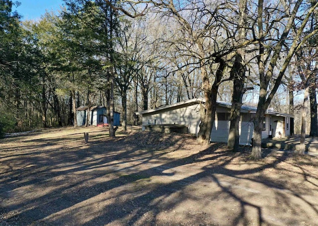 exterior space featuring a storage shed