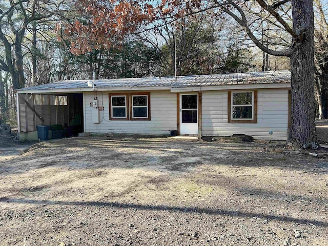 ranch-style house with a carport