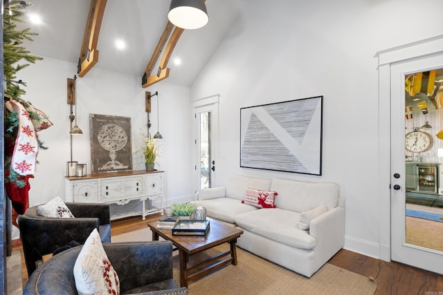 living room with hardwood / wood-style flooring, high vaulted ceiling, and beamed ceiling