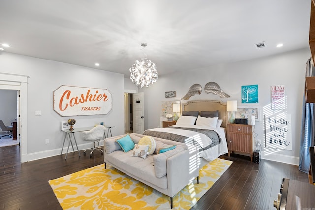 bedroom featuring an inviting chandelier and dark hardwood / wood-style floors