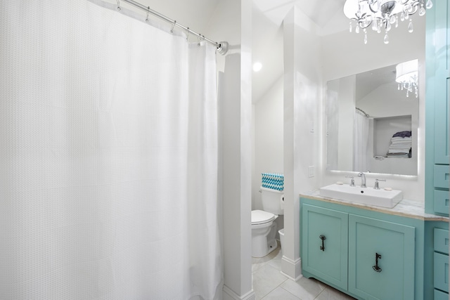 bathroom featuring tile patterned flooring, vanity, and toilet