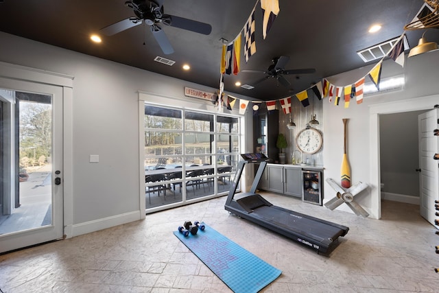 exercise area with plenty of natural light, wine cooler, and ceiling fan