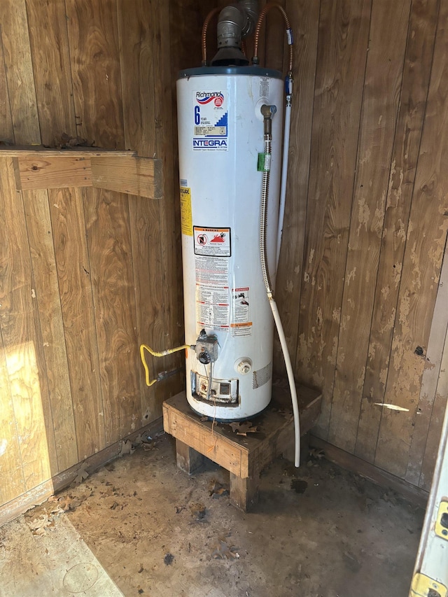 utility room featuring gas water heater