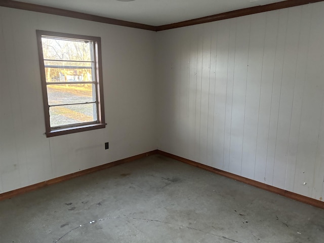 unfurnished room featuring wooden walls