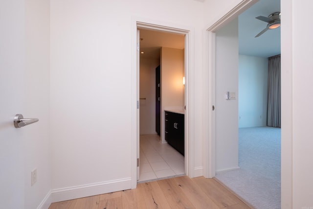 hall with light wood-type flooring