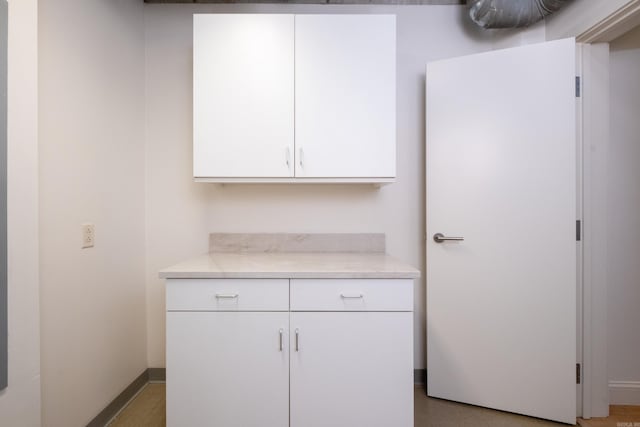 kitchen featuring white cabinetry