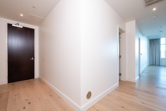 hallway with light wood-type flooring