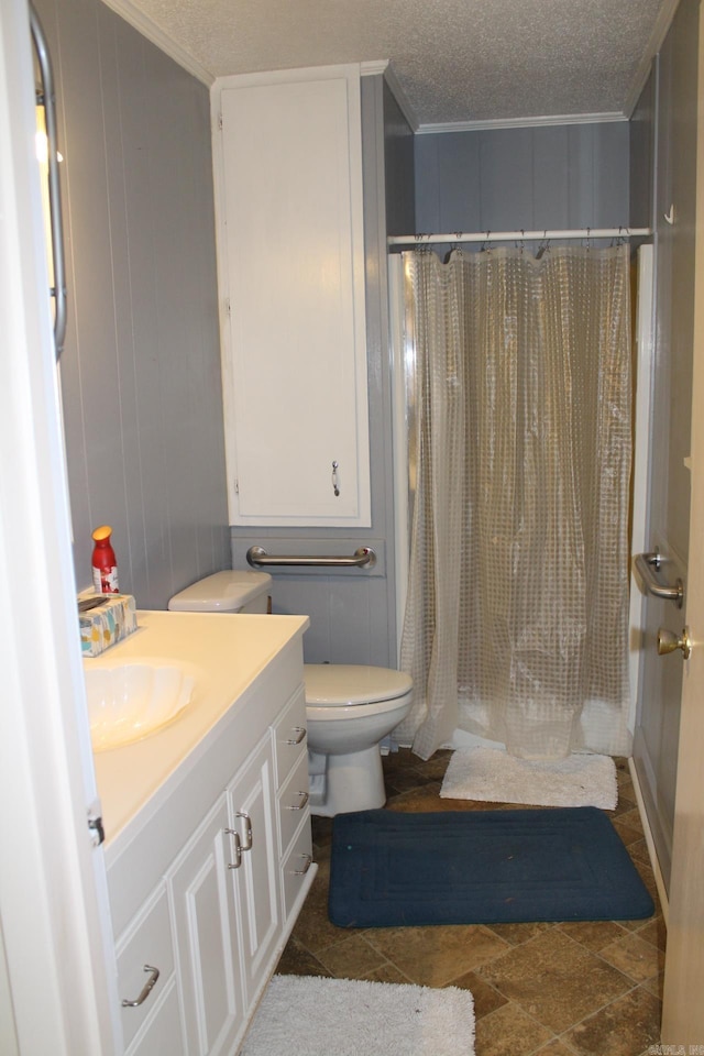 bathroom featuring vanity, wood walls, a textured ceiling, and walk in shower