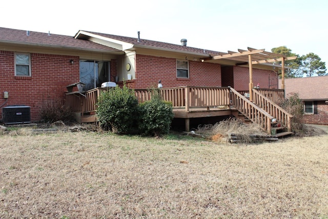 back of house with central AC and a deck