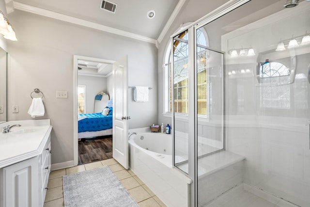 bathroom featuring vanity, ornamental molding, tile patterned floors, and shower with separate bathtub