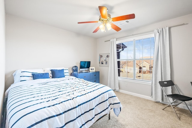 bedroom featuring light carpet and ceiling fan