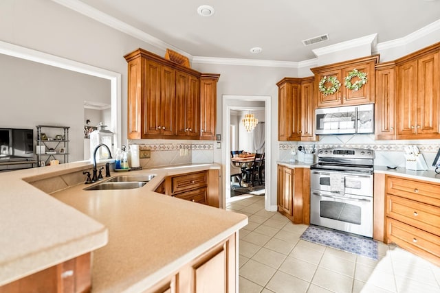 kitchen featuring appliances with stainless steel finishes, sink, backsplash, light tile patterned floors, and crown molding