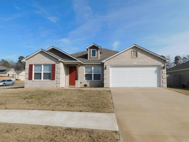 view of front of property featuring a garage and a front lawn