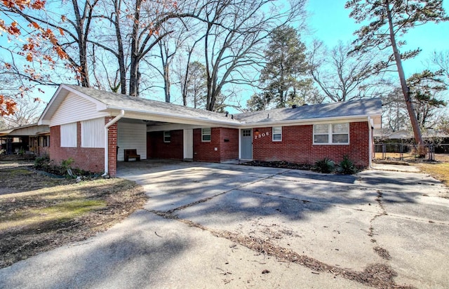 single story home featuring a carport