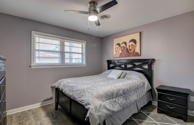 bedroom featuring hardwood / wood-style flooring and ceiling fan