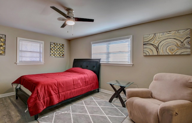 bedroom featuring wood-type flooring and ceiling fan