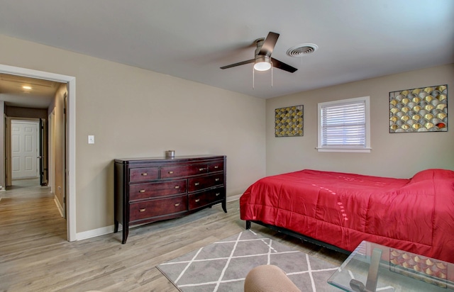 bedroom with light wood-type flooring and ceiling fan