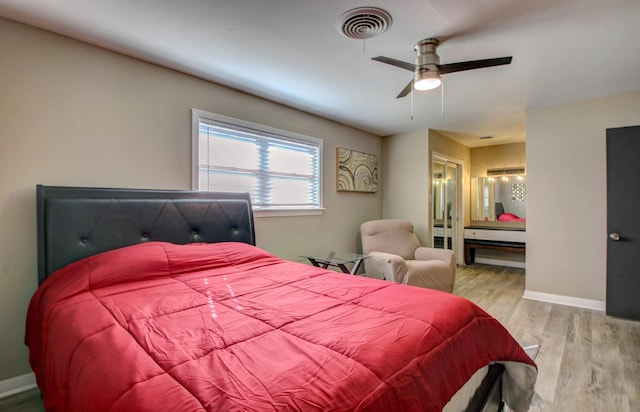 bedroom with ceiling fan and light hardwood / wood-style floors