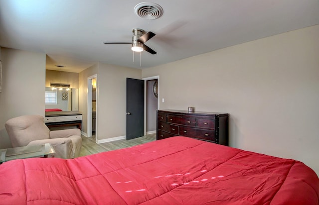 bedroom featuring connected bathroom, ceiling fan, and light hardwood / wood-style floors