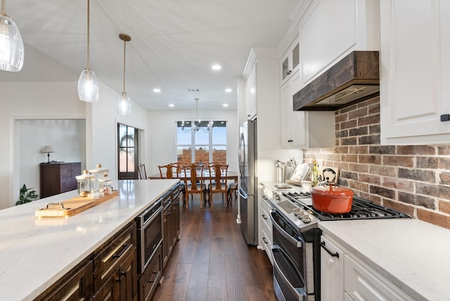 kitchen featuring white cabinetry, appliances with stainless steel finishes, and light stone counters