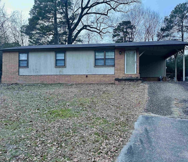 view of front of property featuring a carport