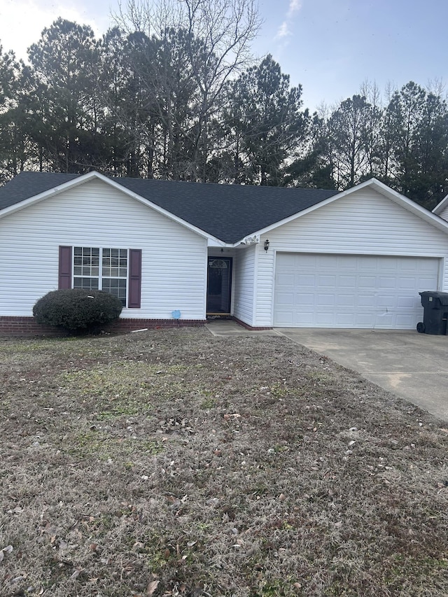 ranch-style home with a garage