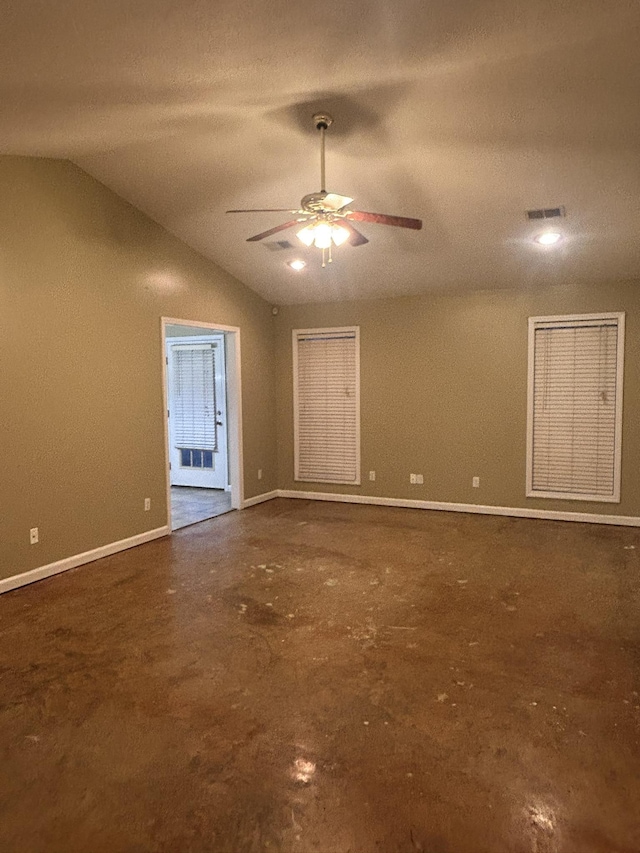 unfurnished room with ceiling fan and lofted ceiling