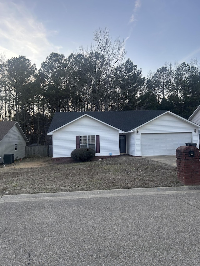 single story home with a garage and central AC