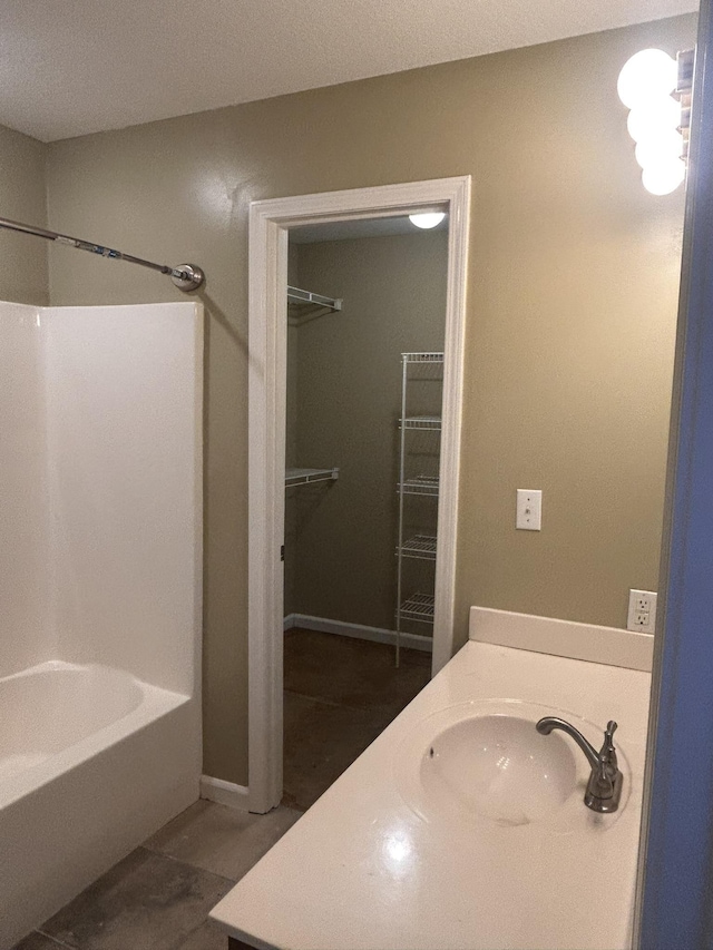 bathroom featuring vanity and bathtub / shower combination