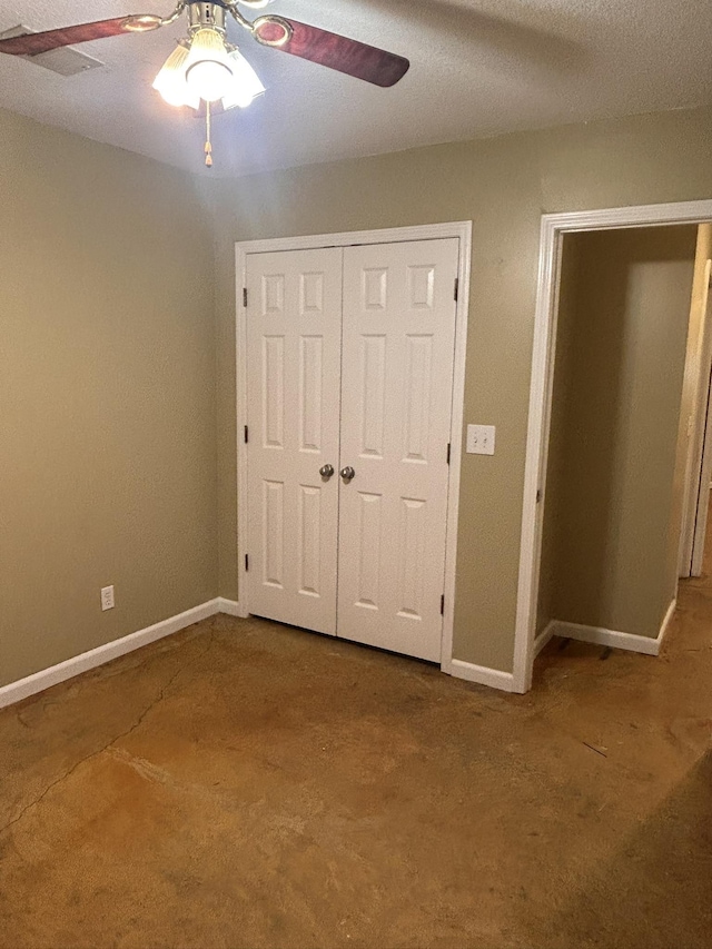 unfurnished bedroom featuring carpet floors, ceiling fan, and a closet