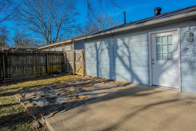 view of side of property with a patio area