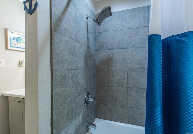 bathroom featuring shower / bath combination with curtain and vanity