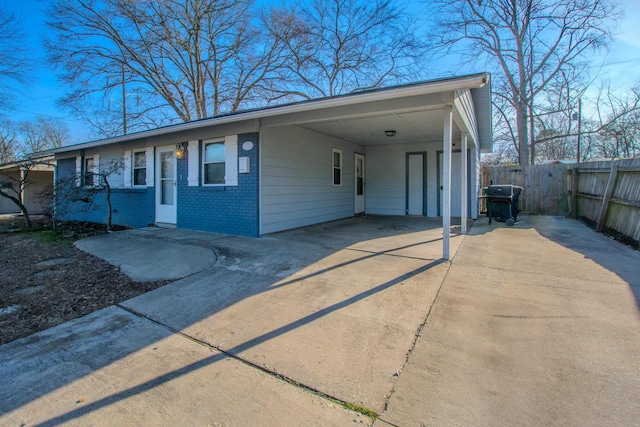 single story home with a carport